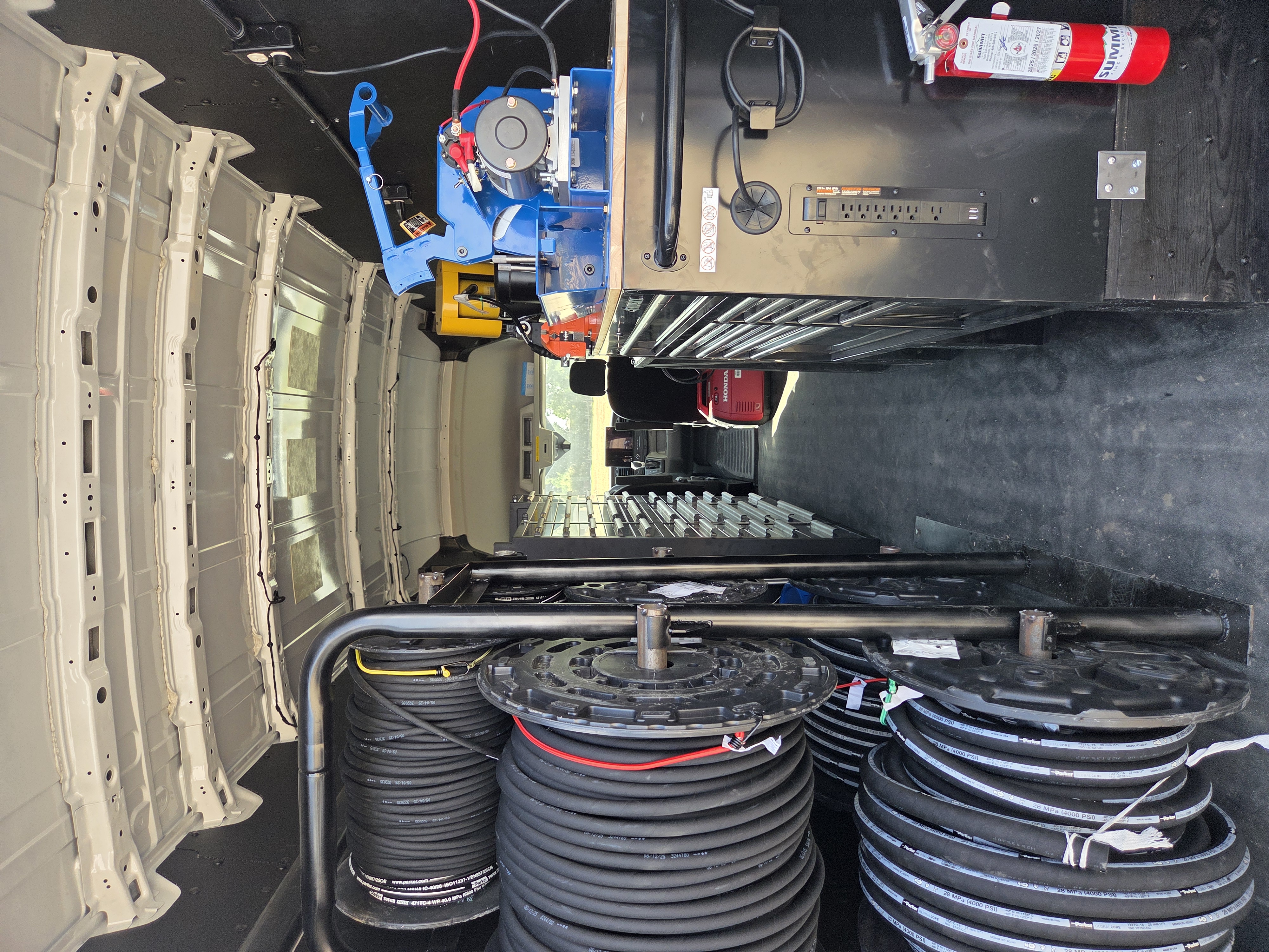 On-board hydraulic hose crimping station